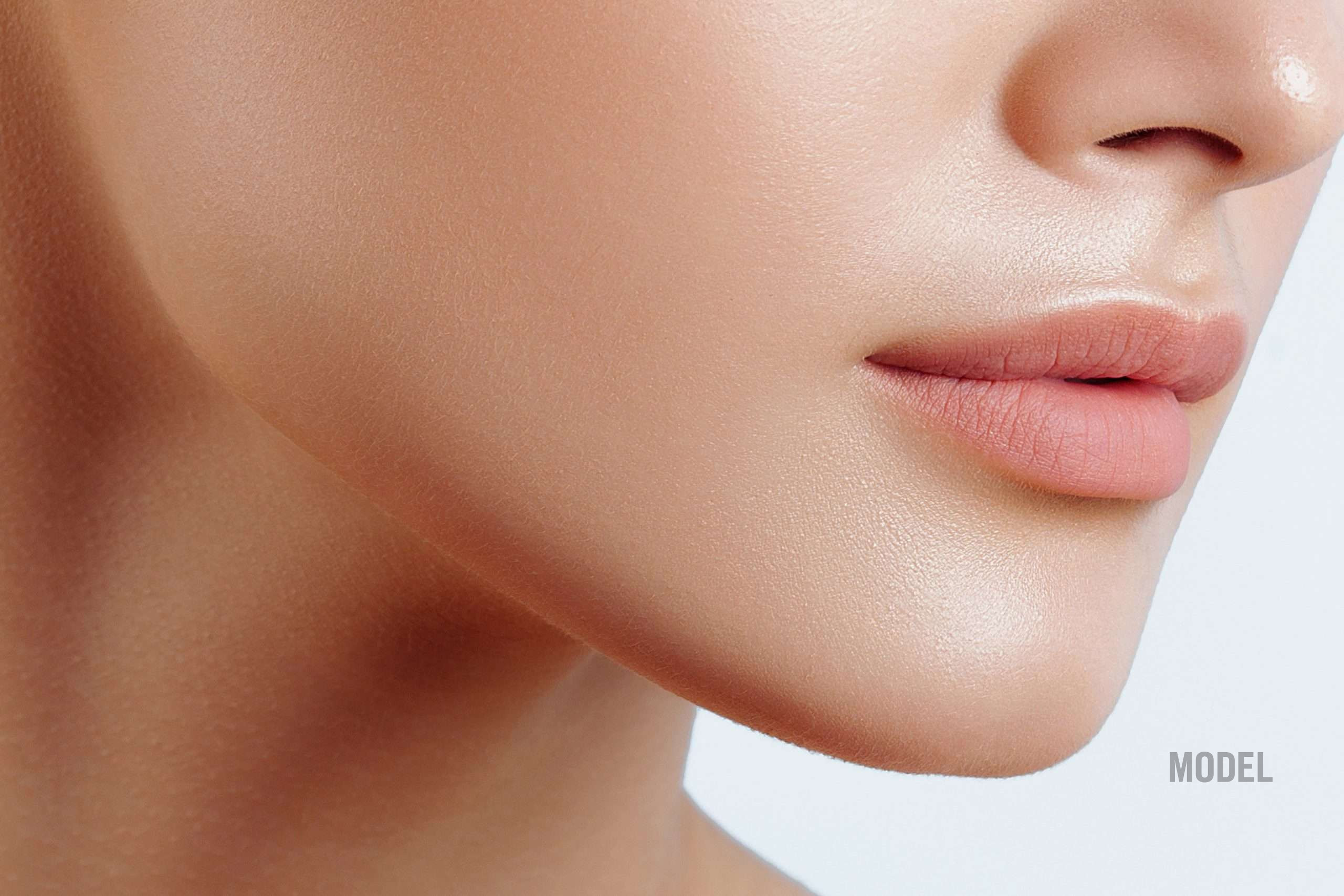 Close-up of young woman with smooth skin for chin augmentation