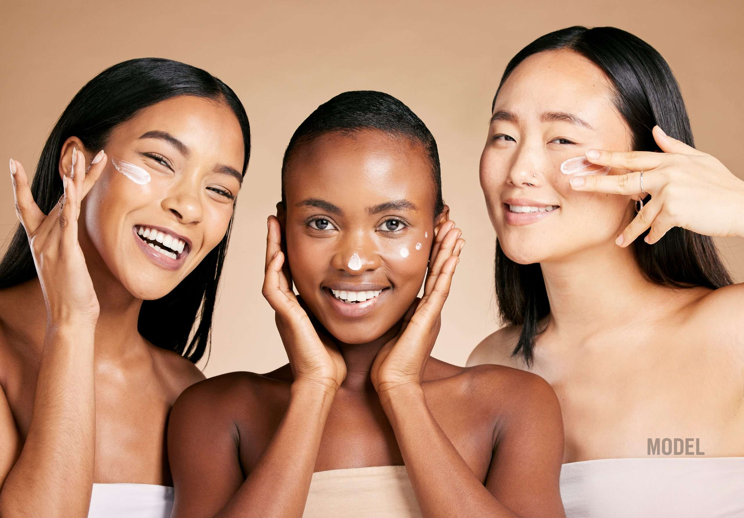 Woman applying face cream in Los Angeles and Santa Monica