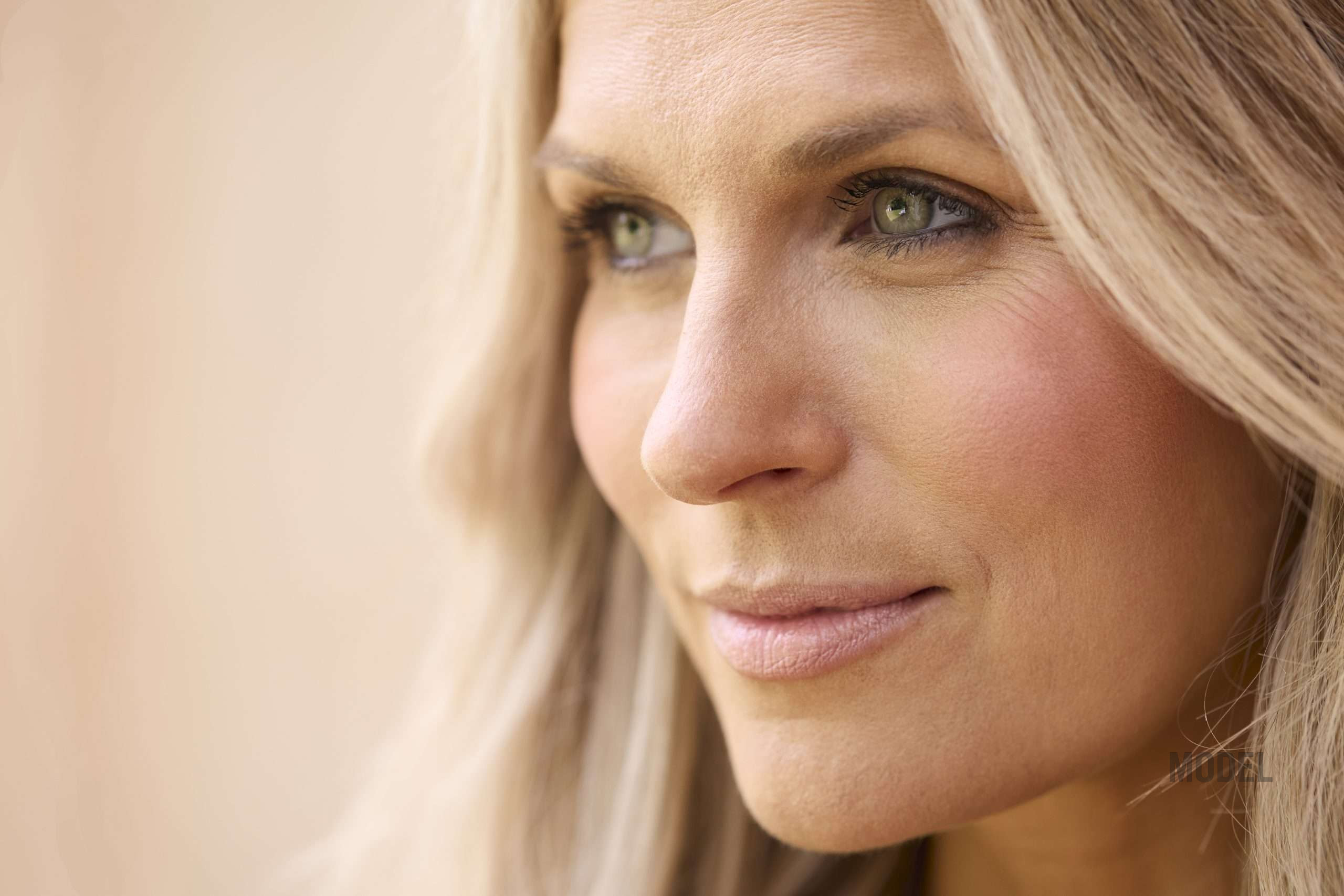 Woman with natural-looking facelift results and preserved facial expression